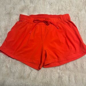 LULULEMON ON THE FLY SHORTS - women red/orange size 4